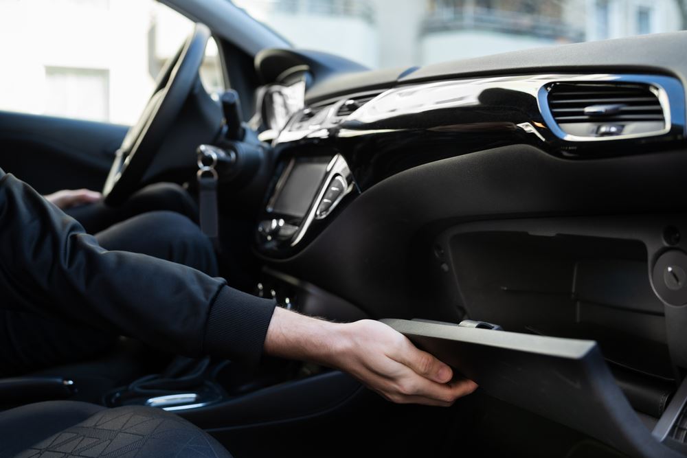 Man opening an empty glovebox